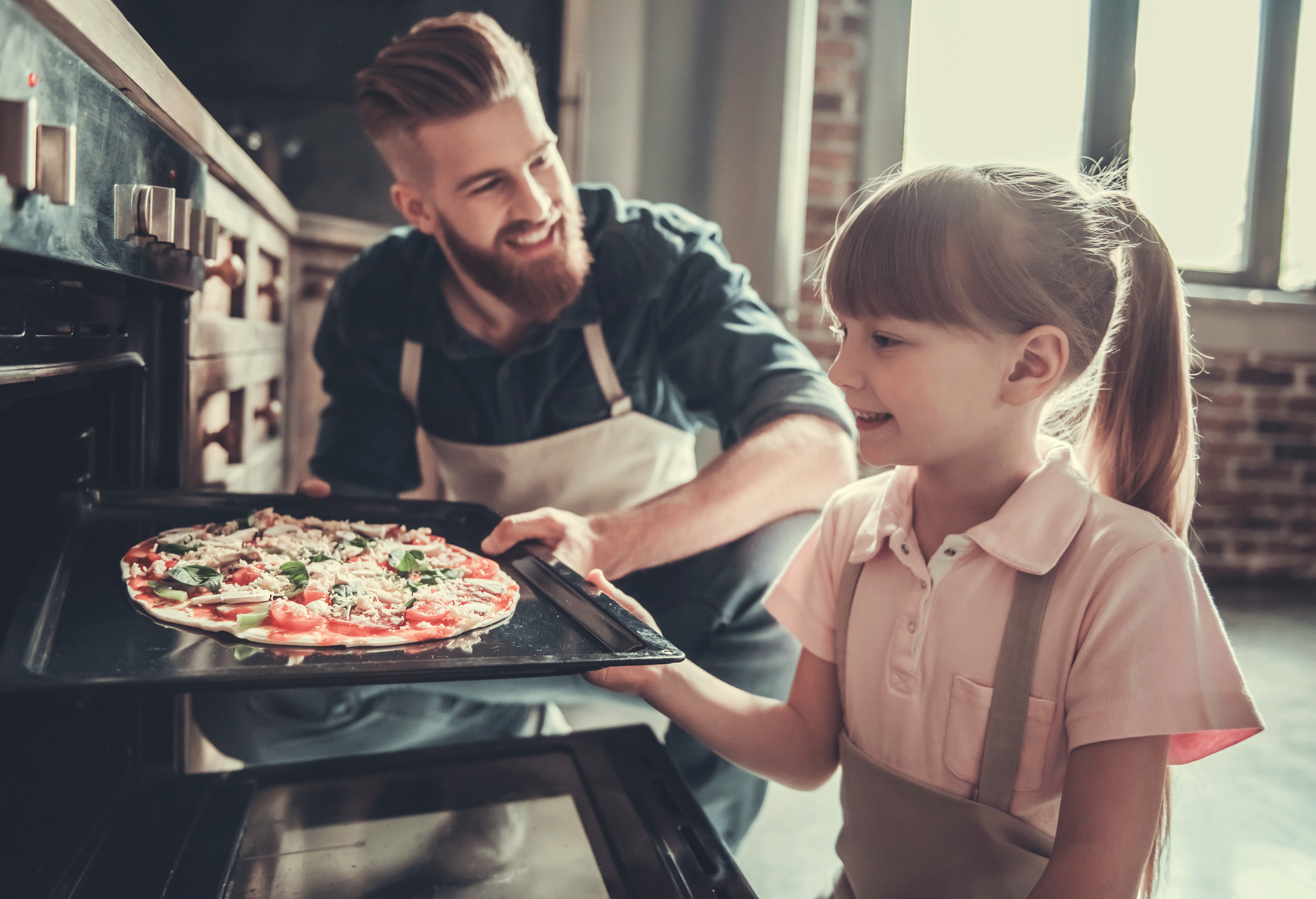 Father and Daughter make pizza